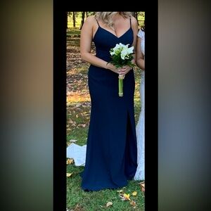 Navy floor length gown in crepe fabric with v neck and side slit